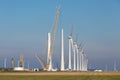 Construction site of new big Dutch wind farm in agricultural landscape