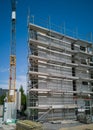 Construction site for a new  multistoried building with scaffold and crane Royalty Free Stock Photo