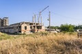 Construction site. Nice photo of unfinished building with blue sky in the background in a sunny day.