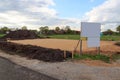 Construction site for one family house filled with sand and empty sign with copy space in building area after earthworks, Germany Royalty Free Stock Photo