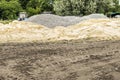 Construction site with piles of sand, gravel and earth and trace Royalty Free Stock Photo