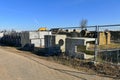 Construction site with pipe and concrete for building houses surrounded with fencing