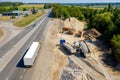 Construction site. Construction of a plant for the production of asphalt. Heavy machinery on road. Royalty Free Stock Photo