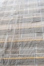 Construction site with a protective safety net on the facade of a building with scaffolding Royalty Free Stock Photo