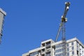 Construction site. Reinforced concrete frame of a multi-storey building and construction cranes. The final stage of construction. Royalty Free Stock Photo