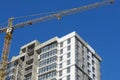 Construction site. Reinforced concrete frame of a multi-storey building and construction cranes. The final stage of construction. Royalty Free Stock Photo