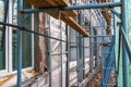 Construction site restoration work on the renovation of the old facade of the building Royalty Free Stock Photo