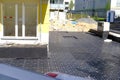 construction site, row black plastic slabs for landscaping land in front of new house, new multi-storey building, building Royalty Free Stock Photo