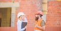 Construction site safety inspection. Discuss progress project. Construction project inspecting. Safety inspector concept Royalty Free Stock Photo