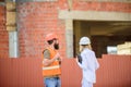 Construction site safety inspection. Discuss progress project. Safety inspector concept. Woman inspector and bearded Royalty Free Stock Photo