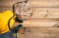 Construction safety. Protective hard hat, headphones, gloves and glasses on wooden background, copy space, top view Royalty Free Stock Photo