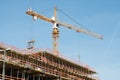 Construction site - scaffolding and crane on bulding site