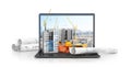 Construction site on the screen of a laptop computer, skyscraper, drawing plan, building materials. Royalty Free Stock Photo