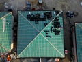 construction site with several roofs in progress. Roofs with vapor-