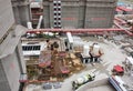 Construction site in Shanghai, China with cement mixers, scaffolding, building materials