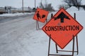 construction site signs on snow covered road Royalty Free Stock Photo