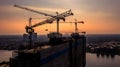 Construction site silhouette background, Hoisting cranes and new multi-storey buildings, Aerial view Industrial background