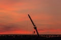 Construction site  silhouette on sunset background Royalty Free Stock Photo