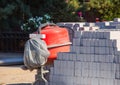 At the construction site stand piled sand-lime brick and concrete mixer Royalty Free Stock Photo