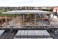 Construction site with steel formworks and reinforcing bars for pillars ready for concrete