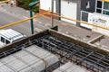 Construction site with steel formworks and reinforcing bars for