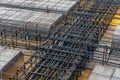 Construction site with steel formworks and reinforcing bars for