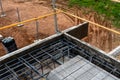 Construction site with steel formworks and reinforcing bars for