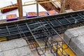 Construction site with steel formworks and reinforcing bars for