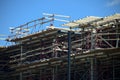 Construction worker on building metal beams structure