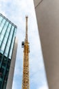 Construction site with tall cranes on background of modern office buildings city centre blue sky clouds Royalty Free Stock Photo