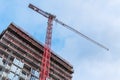Construction Site with Tall Tower Crane Royalty Free Stock Photo