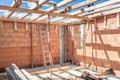 Construction site tools and details - metal ladder, brick layers, wood, timber