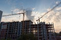 Construction Site with Tower Cranes at Sunset Royalty Free Stock Photo