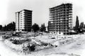 black and white photo showing construction site with two multi story buildings one completed and one under construction in daytime Royalty Free Stock Photo