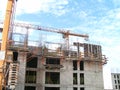Construction site in Venezuela shows workers building a multi-story structure under a bright sky Royalty Free Stock Photo