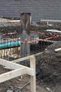 Construction site view with drain and sewage pipes and steel rebar as part of foundation Royalty Free Stock Photo