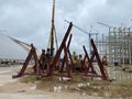 Construction site view of modern biomass co generation plant with people, cranes and construction materials on it