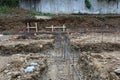 Construction site view over unpoured footings with steel rebar gridwork