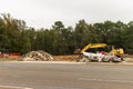 Construction site where a building was torn down using an excavator Royalty Free Stock Photo