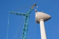 Construction site wind turbine with hoisting of rotor house Royalty Free Stock Photo