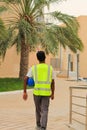 Construction site worker walking for work in Arab country. surveyor, foreman, engineer,industrial worker