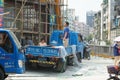 Construction site, workers are loading and unloading building materials