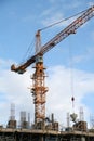 A construction site with a yellow crane