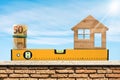 Construction Spirit Level with Roll of Euro Banknotes and a Model House