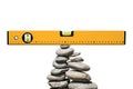 Construction Spirit Level on a Pile of Stones in Balance