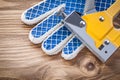 Construction stapler safety working gloves on wood board directl Royalty Free Stock Photo