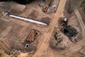 Construction of stormwater pits and sanitary sewer system. Laying of underground storm sewer pipes and sewerage wells.