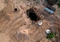 Construction of stormwater pits and sanitary sewer system. Laying of underground storm sewer pipes and sewerage wells.