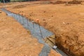 The construction of a strip foundation reinforcement frame for a reinforced concrete house building