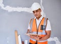 A construction supervisor checks renovation project with checklist on clipboard Royalty Free Stock Photo